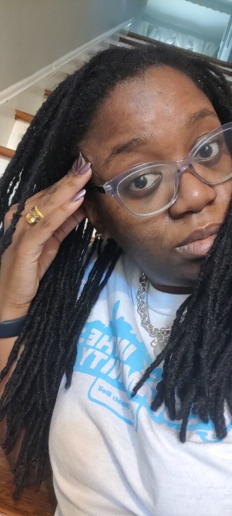 L2 Locs. They made it to the middle of my back before they got whacked. The photo is just me looking at the camera with my hair down and glasses on. 